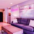 Amour Neon Sign placed in a cozy living room, creating a charming and romantic atmosphere.