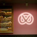 Close-up of the Bagel Neon Sign, with playful and colorful neon lights, perfect for adding character to your space.