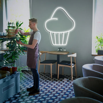 "Cupcake Neon Light illuminated with bright neon colors, creating a whimsical atmosphere for kitchens or dessert shops.