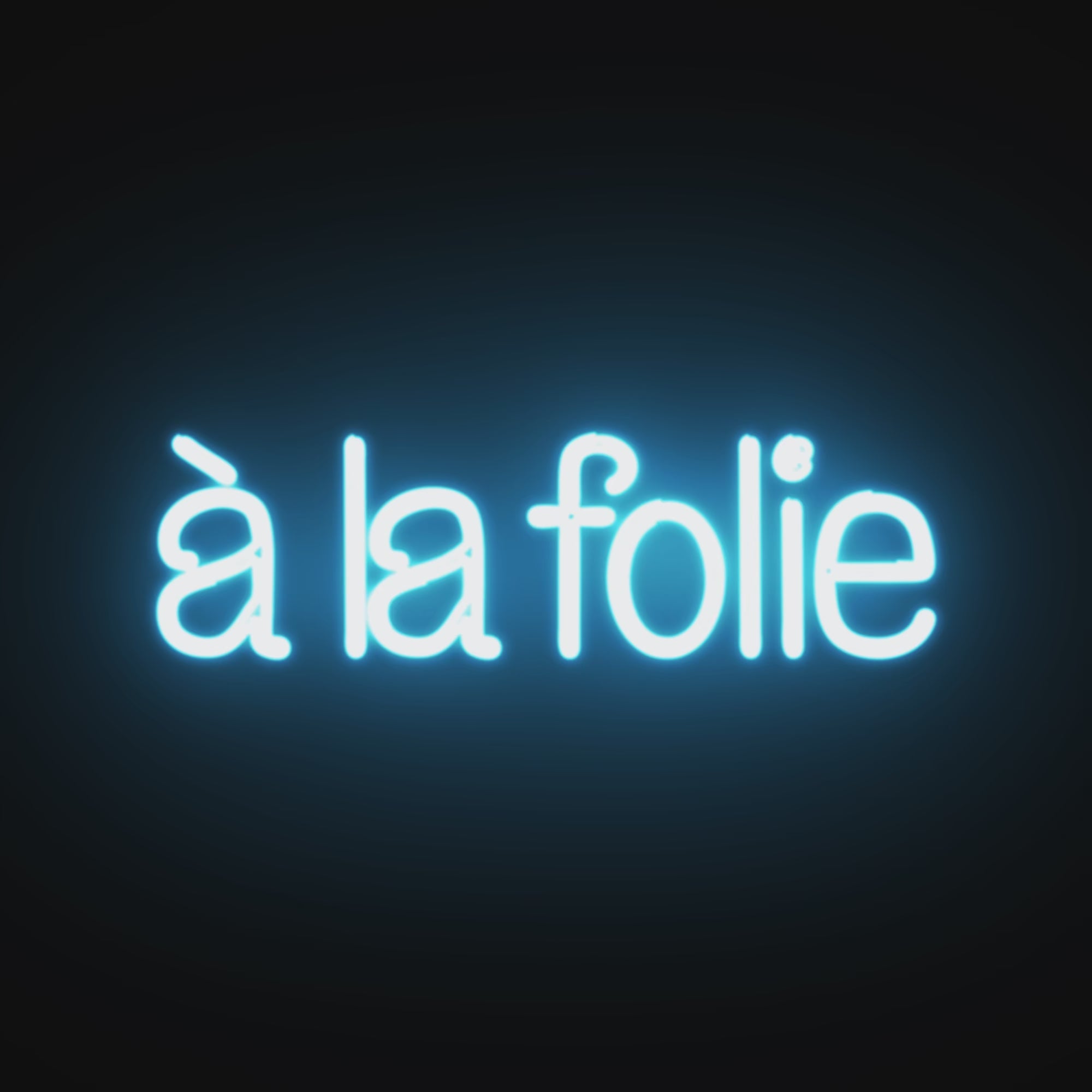 Watch the À la Folie Neon Sign light up, filling your space with a romantic and energetic ambiance.